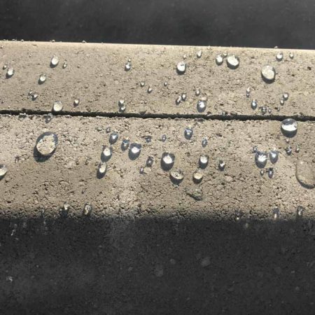 ImperGuard colourless concrete sealant repelling water from concrete surface ImperGuard colourless concrete sealant repelling water from concrete surface