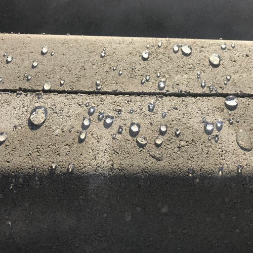 ImperGuard concrete sealant repelling-water from concrete surface