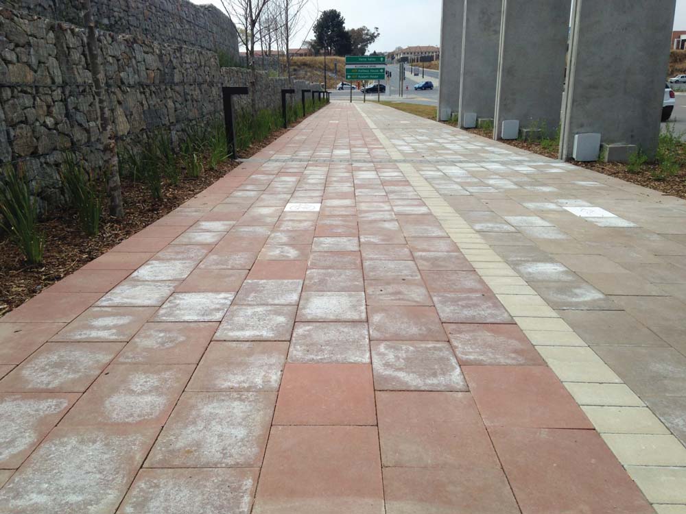 Efflorescence after installation on a newly paved walkway