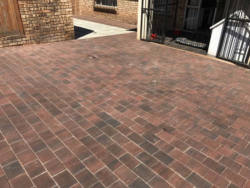 Paving bricks cleaned with an efflorescence cleaner