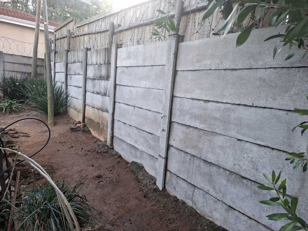 An after image of a prefabricated concrete wall free from any black efflorescence, algae, and moss. Cleaned with Guard Wash Express and Eco